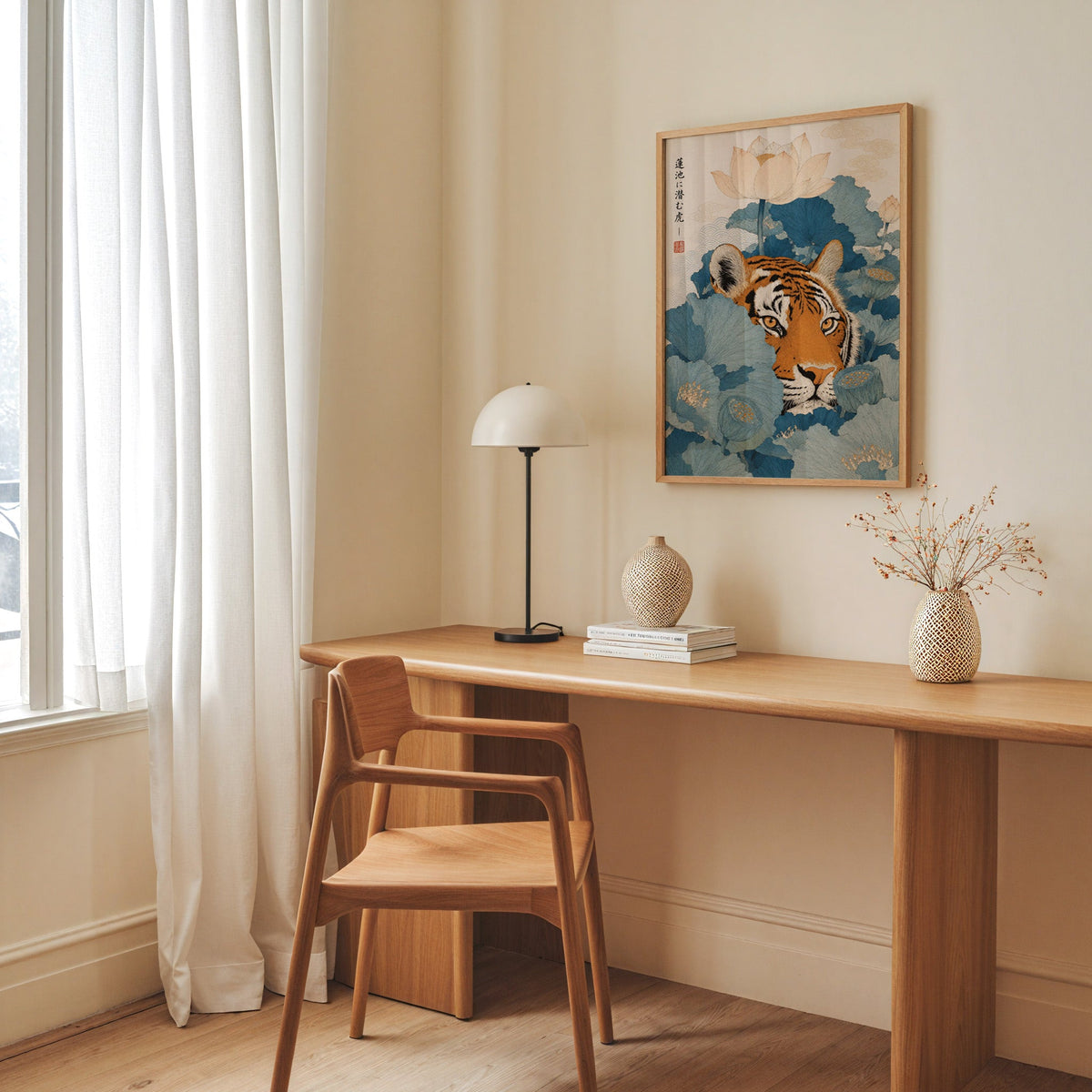 tiger hiding in blue lotus leaves print in an oak frame above a long oak desk with a white dome lamp and woven vases