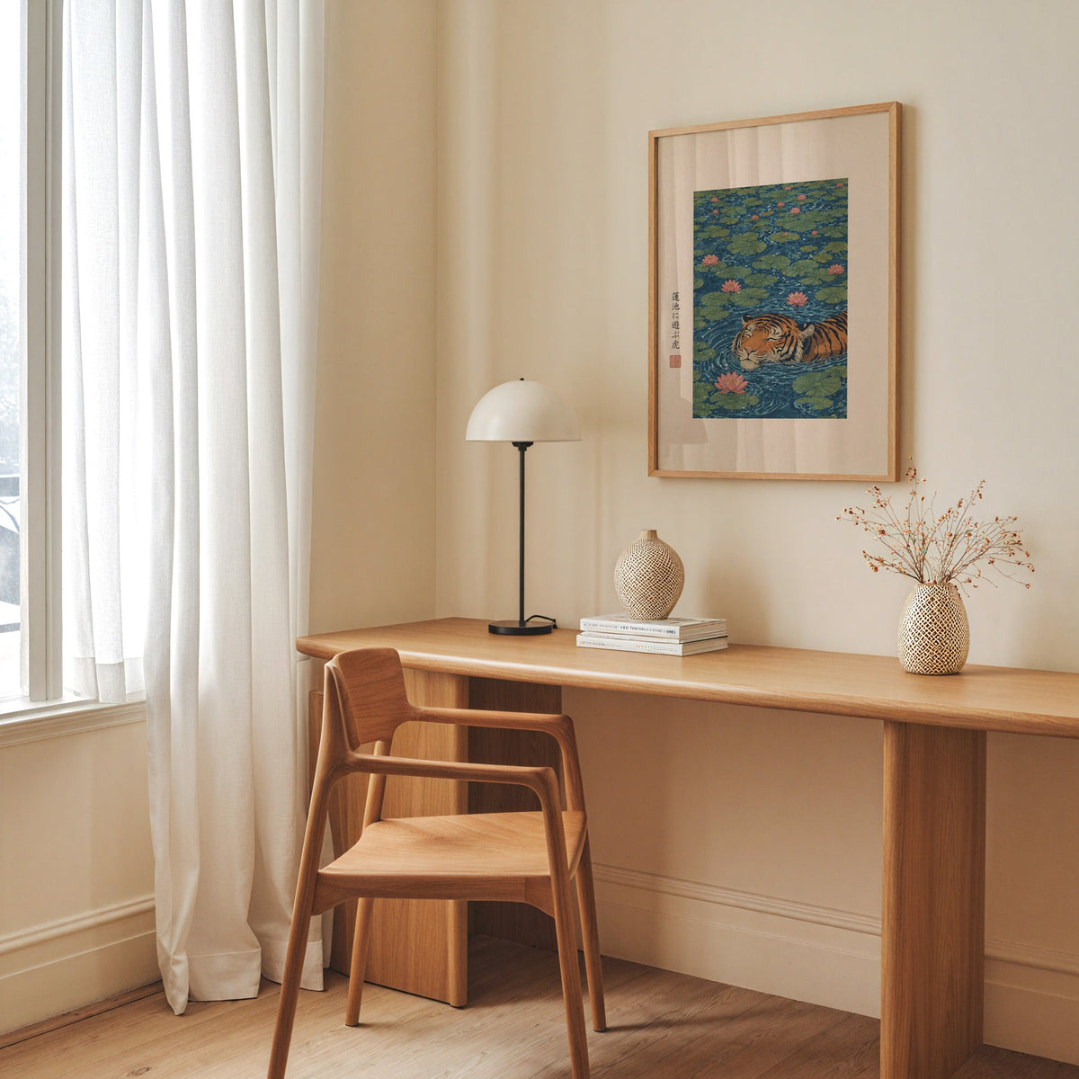 tiger swimming in lotus pond print in an oak frame above a long oak desk with a white dome lamp and woven vases