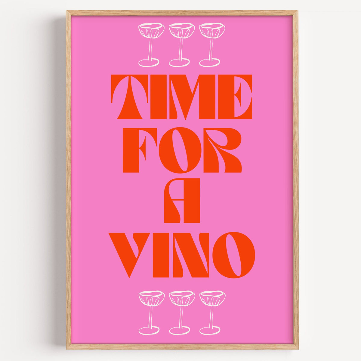 Time for a Vino pink coupes print in a light oak frame on a plain white wall