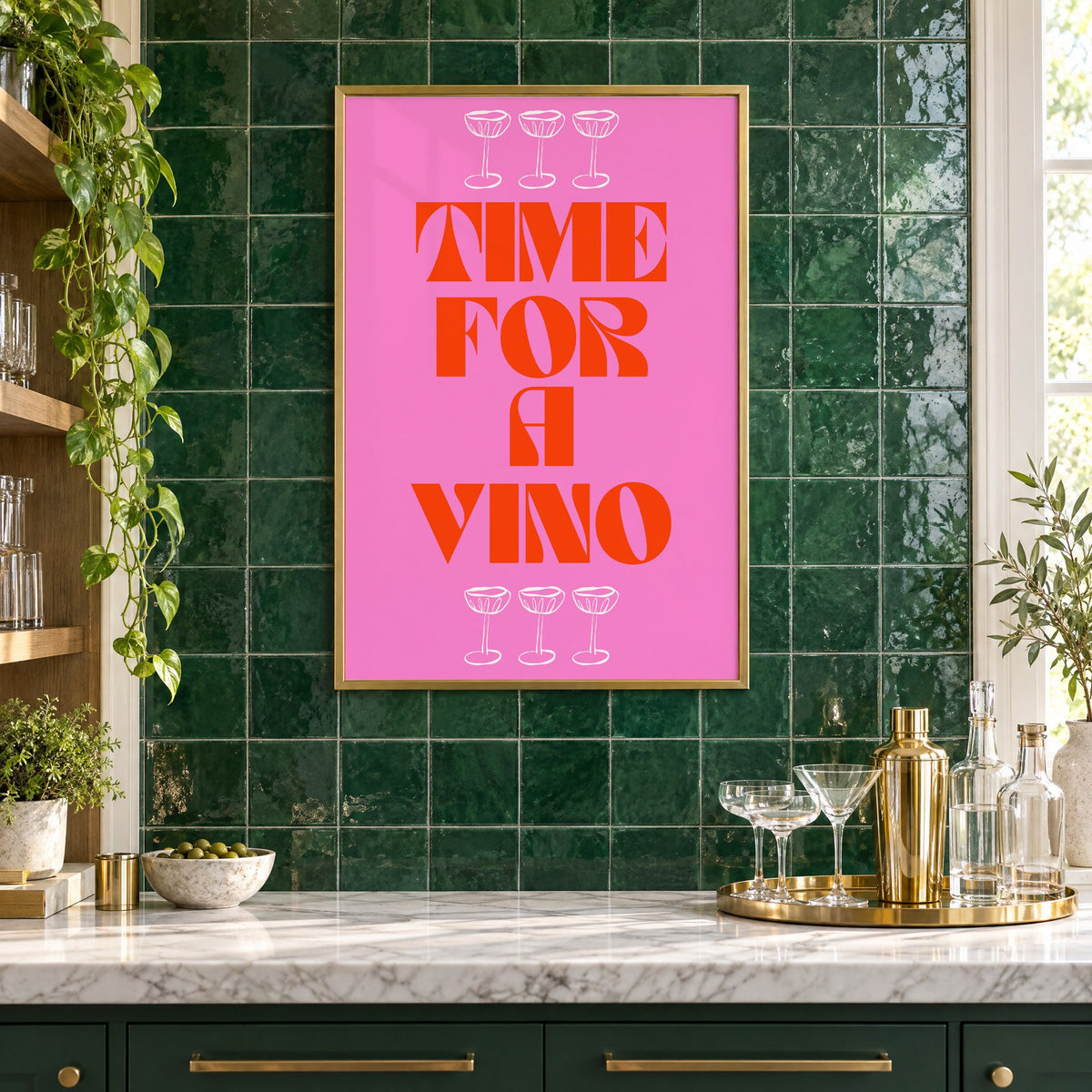 Time for a Vino pink coupes print in a brass frame on emerald green tiles above a home bar with coupe glasses