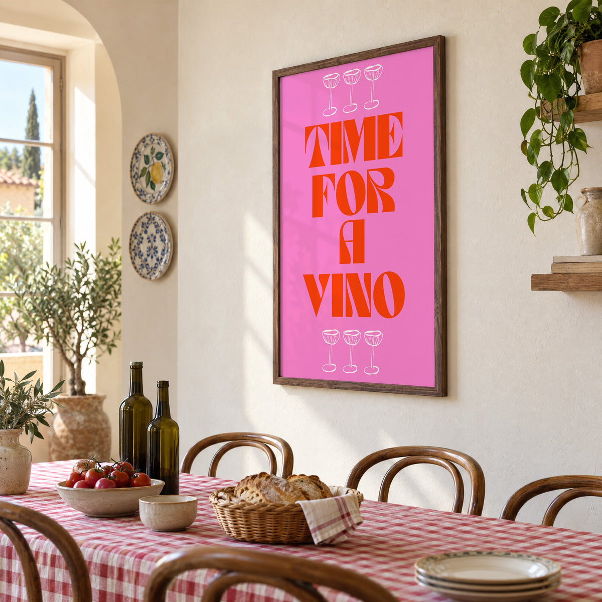Time for a Vino pink coupes print in a walnut frame above a gingham-covered trattoria table, seen at an angle
