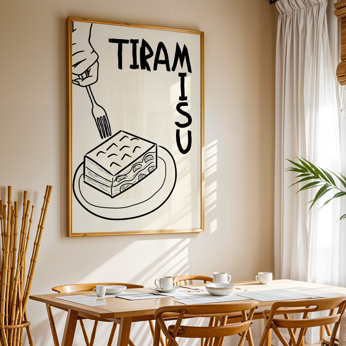 Tiramisu line art print in a gold frame above a sunlit breakfast table