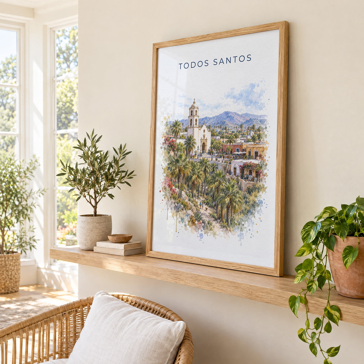 Todos Santos watercolor print in an oak frame on a picture ledge in a sunlit sunroom