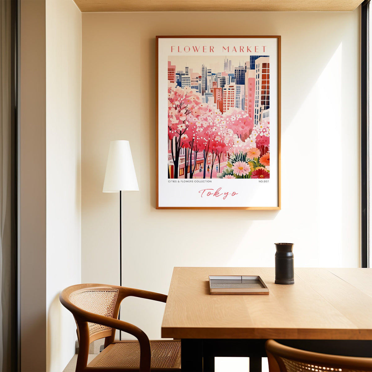 Tokyo flower market print in an oak frame above a dining table and cane chair