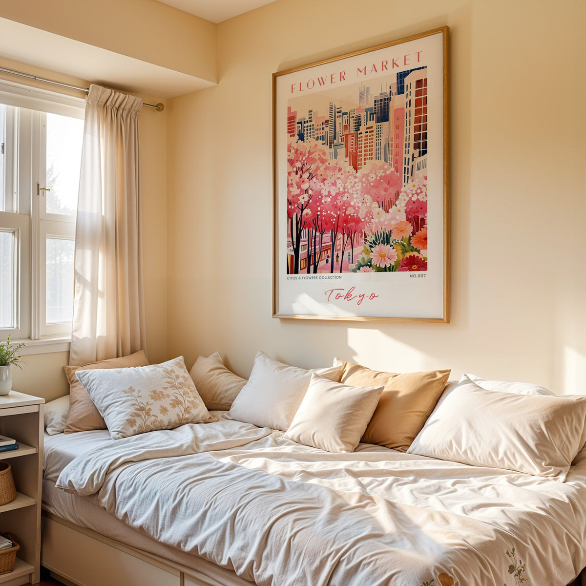 Tokyo flower market print in an oak frame above a cream daybed in a sunny bedroom