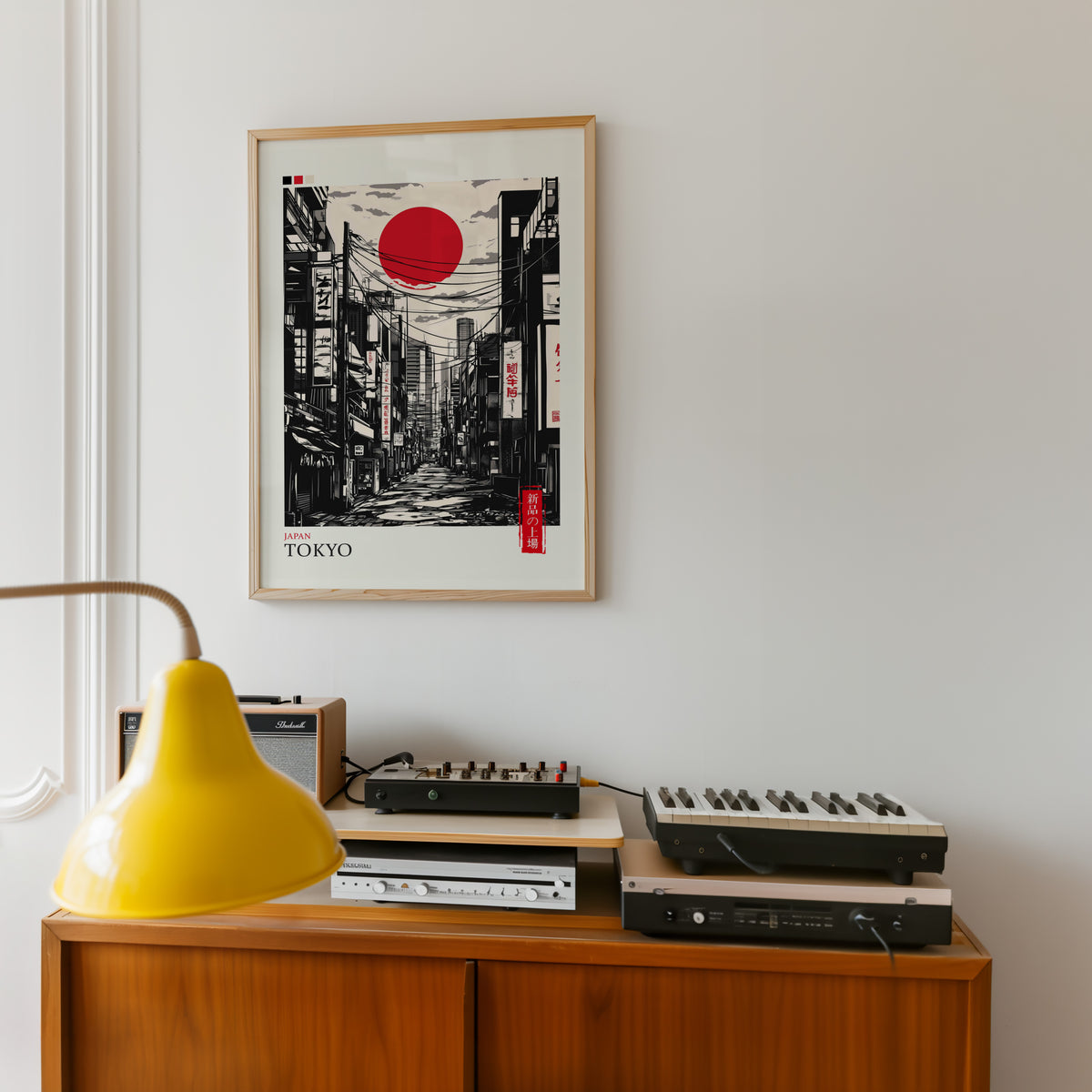 Tokyo ink street with red sun print in an oak frame above a teak sideboard with vintage hi-fi