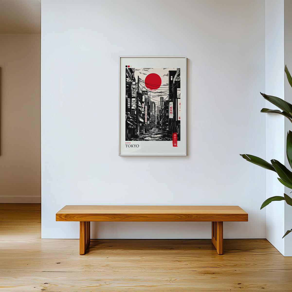 Tokyo ink street with red sun print shown in a white frame above a wooden entryway bench