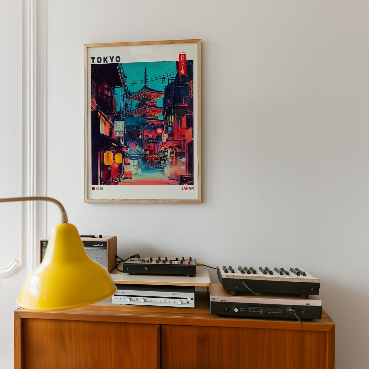 Tokyo neon alley and red pagoda print in an oak frame above a teak sideboard with vintage hi-fi
