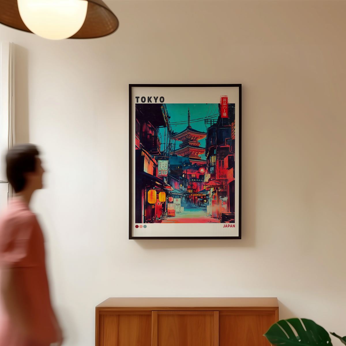 Tokyo neon alley and red pagoda print in a black frame in a hallway under a rattan pendant