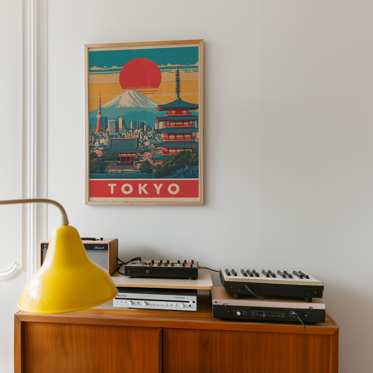 Retro Tokyo red sun skyline print in an oak frame above a teak sideboard with vintage hi-fi