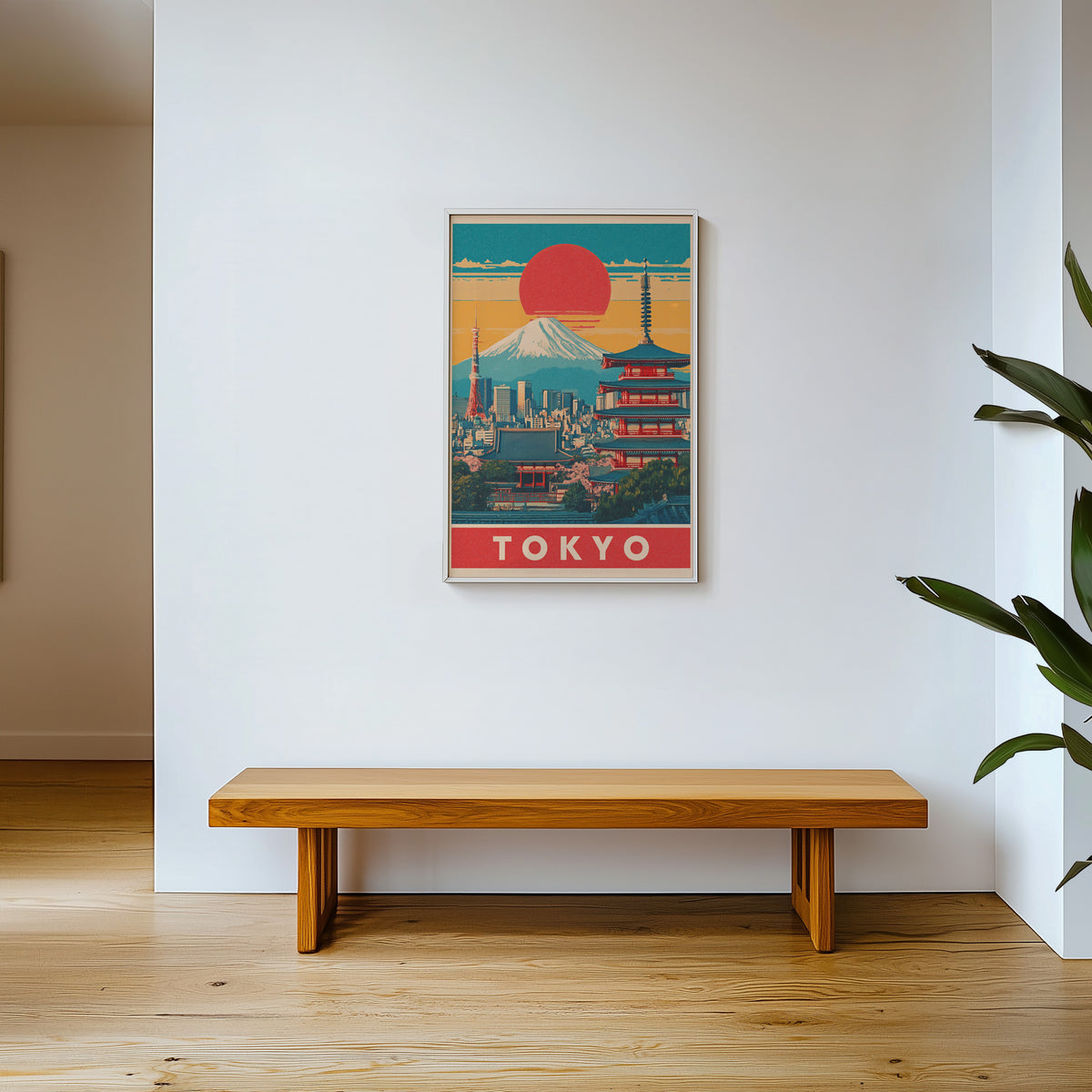 Retro Tokyo red sun skyline print shown in a white frame above a wooden entryway bench