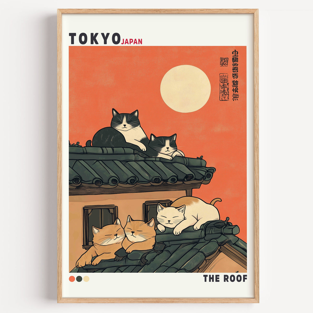 Five cats sleeping on Tokyo roof print in a light oak frame on a plain white wall