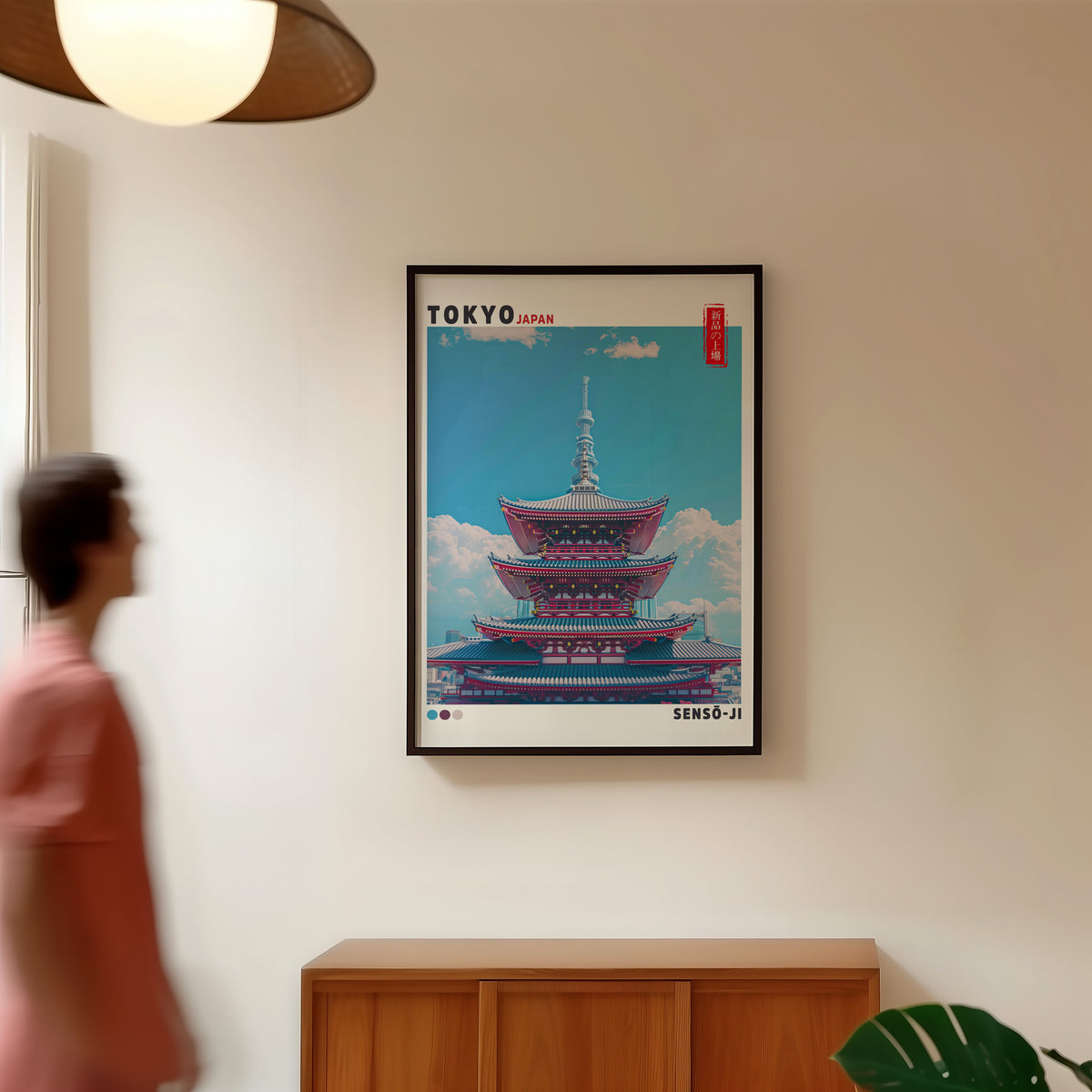 Senso-ji five-story pagoda print in a black frame in a hallway under a rattan pendant