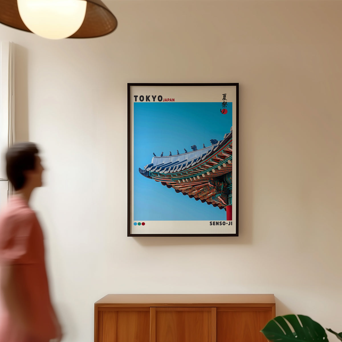Senso-ji green temple roof detail print in a black frame in a hallway under a rattan pendant