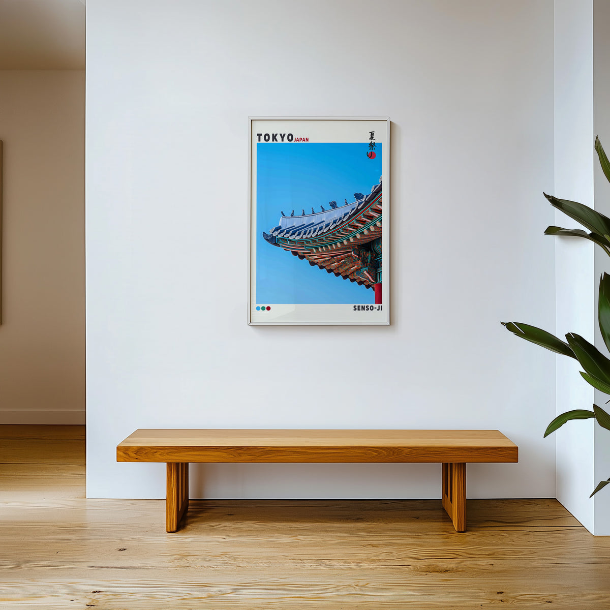 Senso-ji green temple roof detail print shown in a white frame above a wooden entryway bench