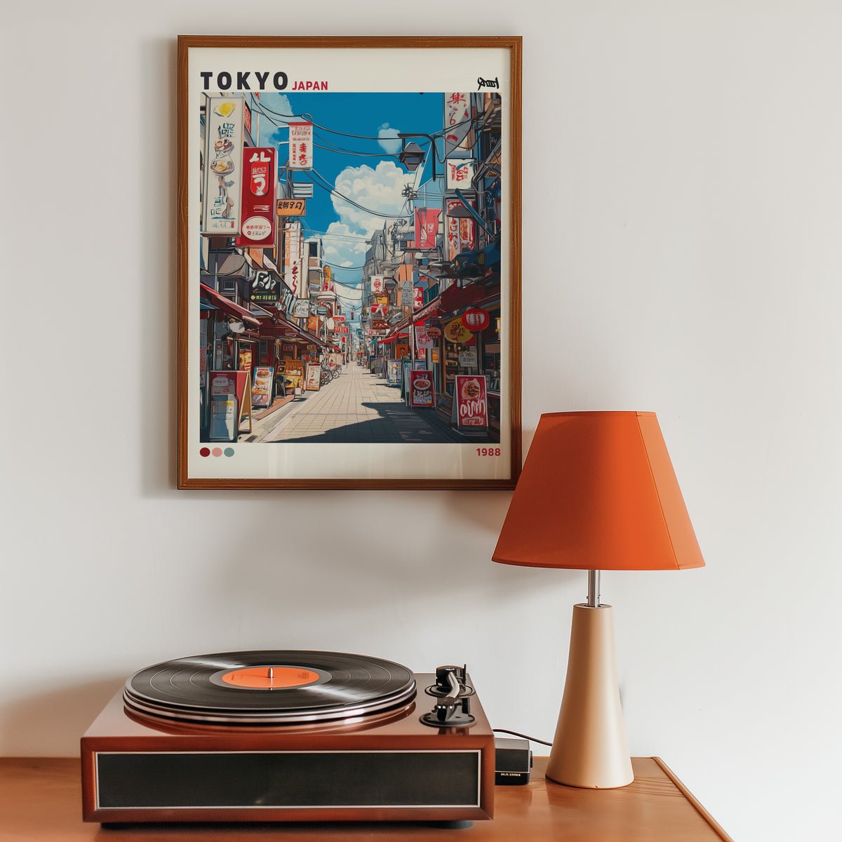 Tokyo shopping street 1988 print in a walnut frame above a sideboard with a record player
