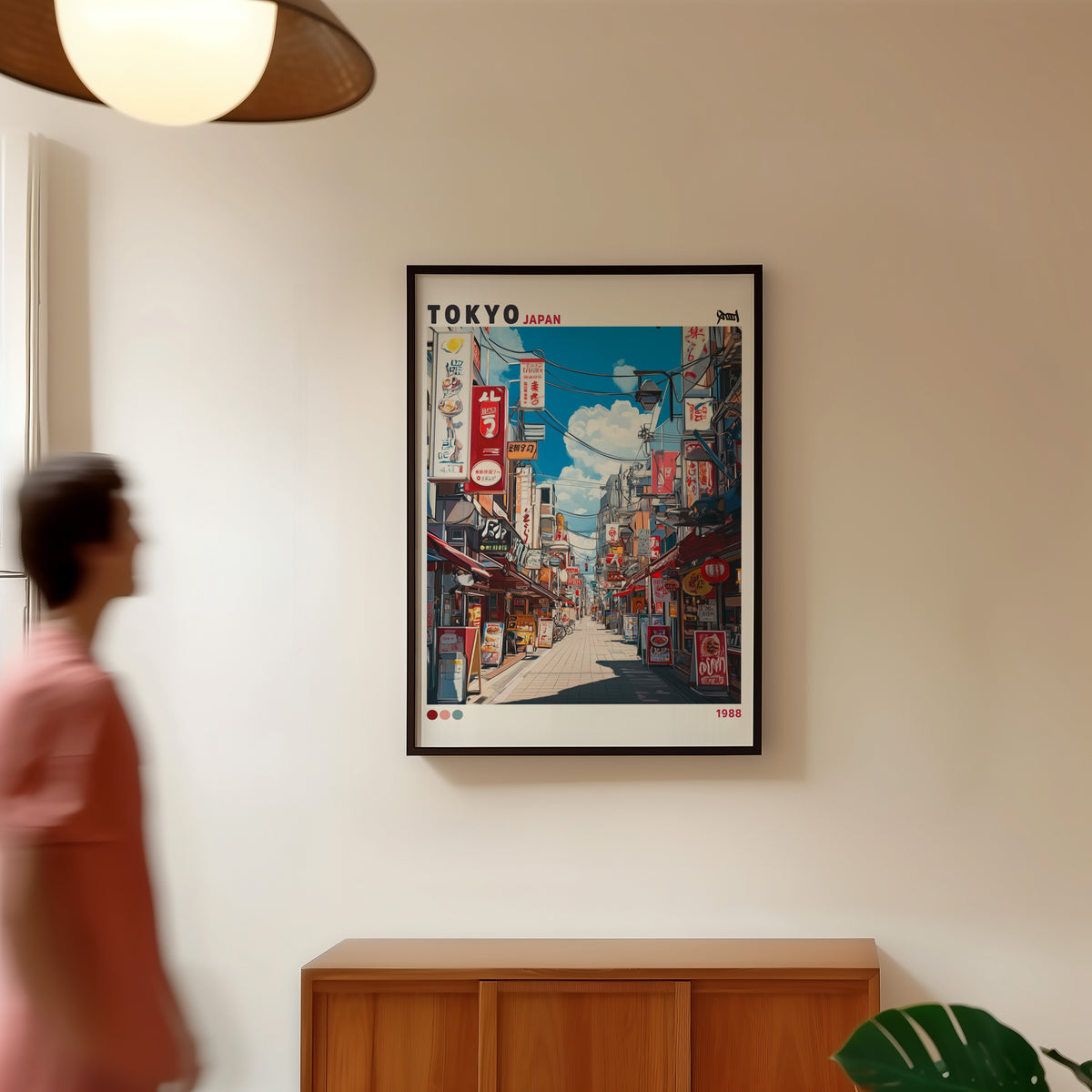 Tokyo shopping street 1988 print in a black frame in a hallway under a rattan pendant