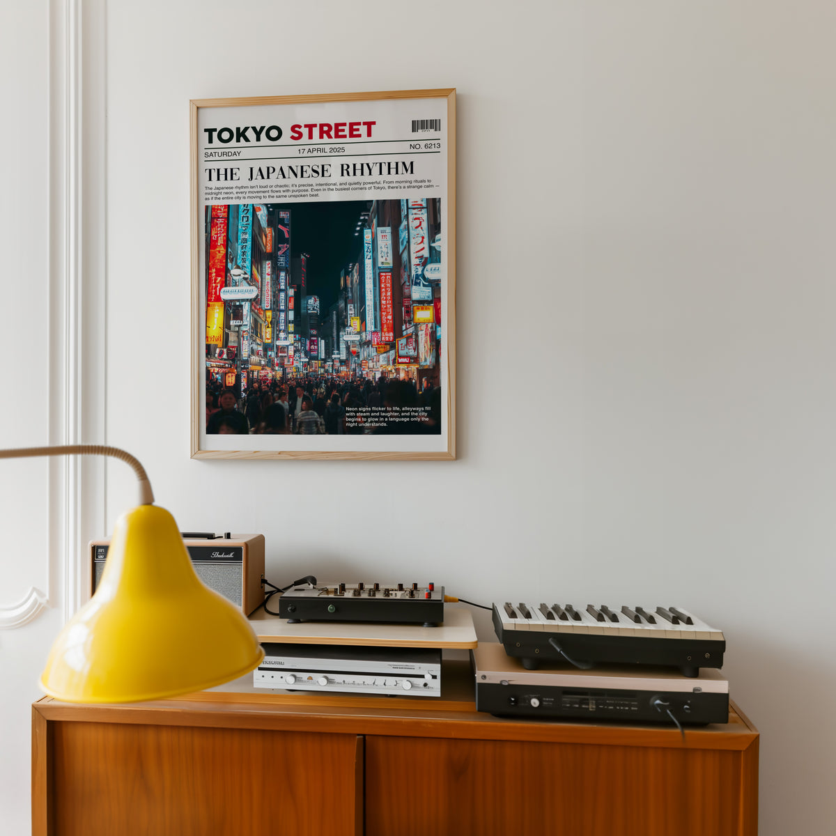 Tokyo street neon newspaper print in an oak frame above a teak sideboard with vintage hi-fi