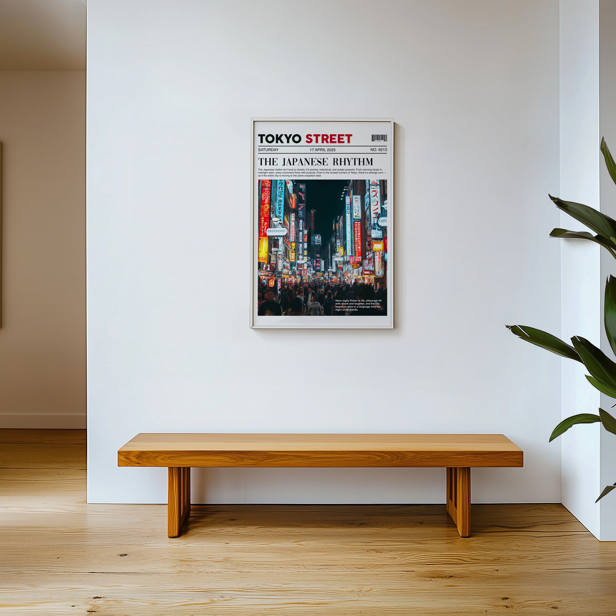 Tokyo street neon newspaper print shown in a white frame above a wooden entryway bench