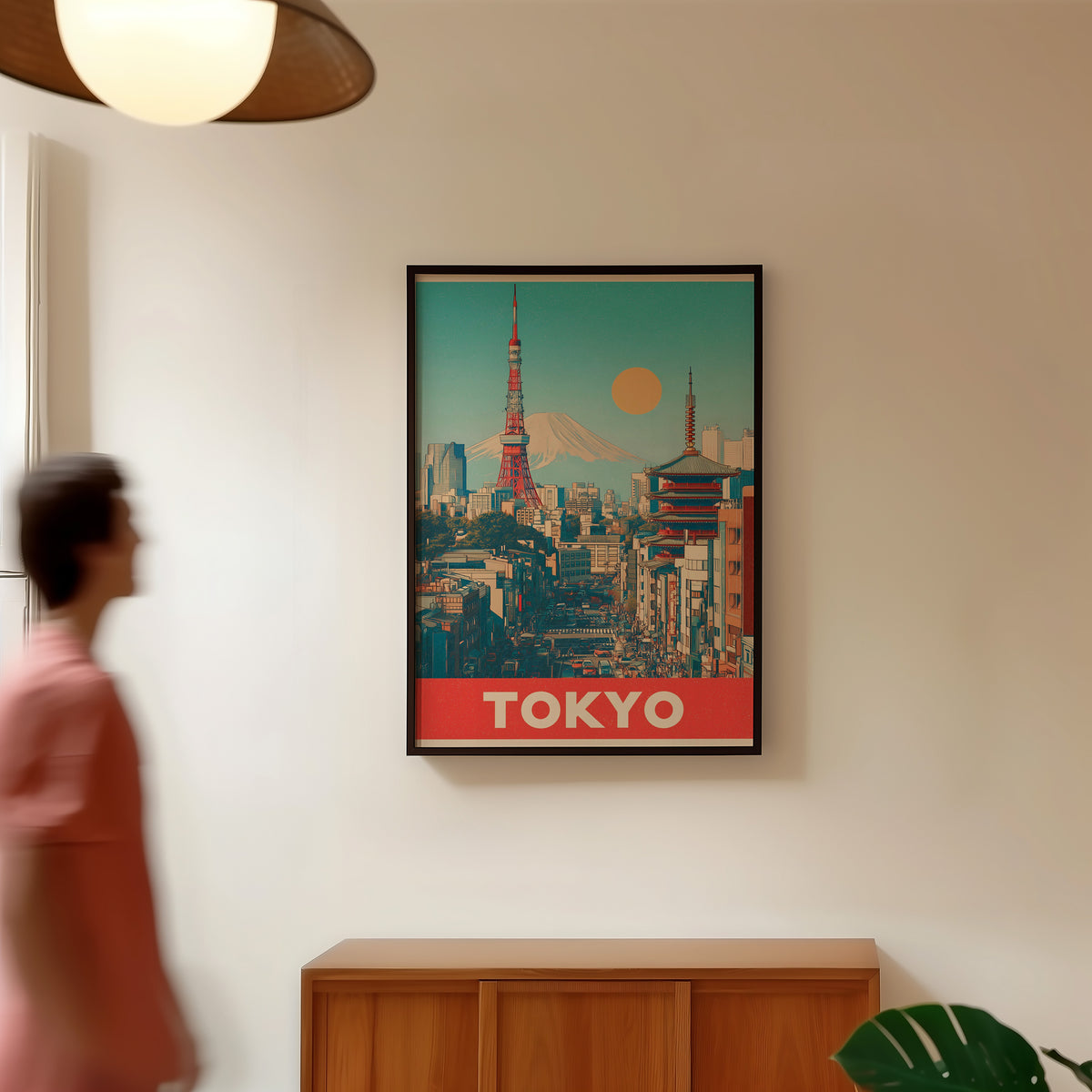 Retro Tokyo Tower and Mount Fuji print in a black frame in a hallway under a rattan pendant