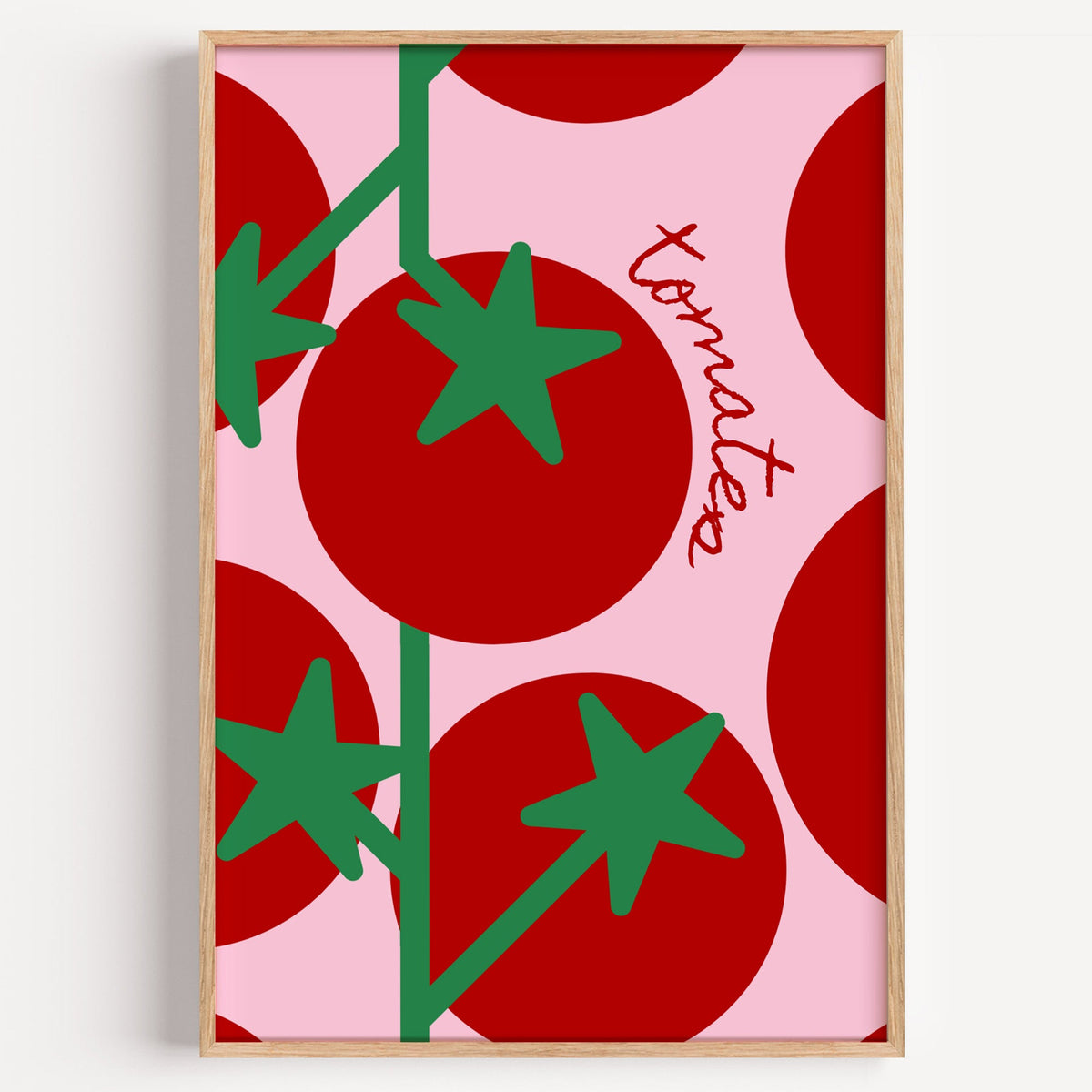 Tomates bold tomato print in a light oak frame on a plain white wall