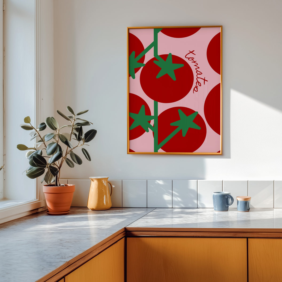 Tomates print in a gold frame above a marble counter with a yellow ceramic jug