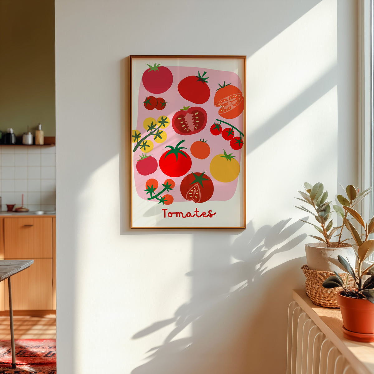 Tomates print shown in a gold frame in sunlight with plants and a kitchen beyond