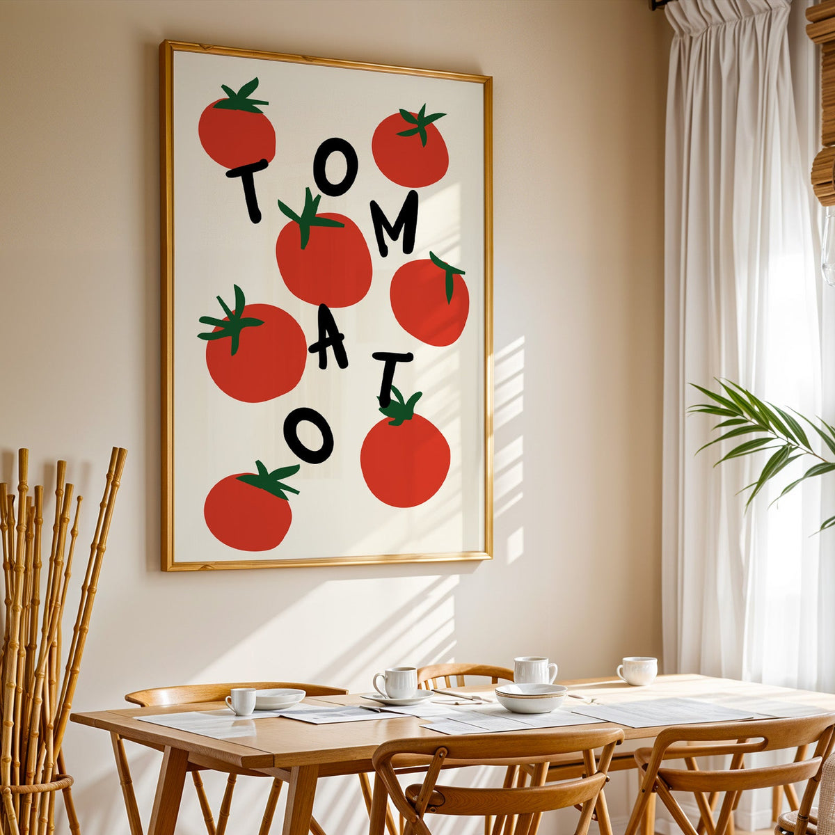 Tomato letters print in a gold frame above a sunlit breakfast table