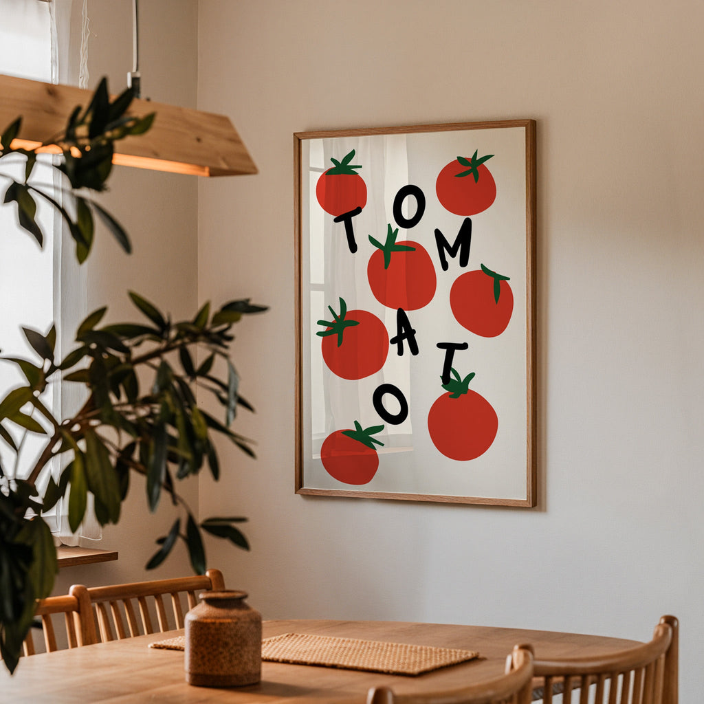 Tomato letters print in a walnut frame above a dining table beside an olive tree