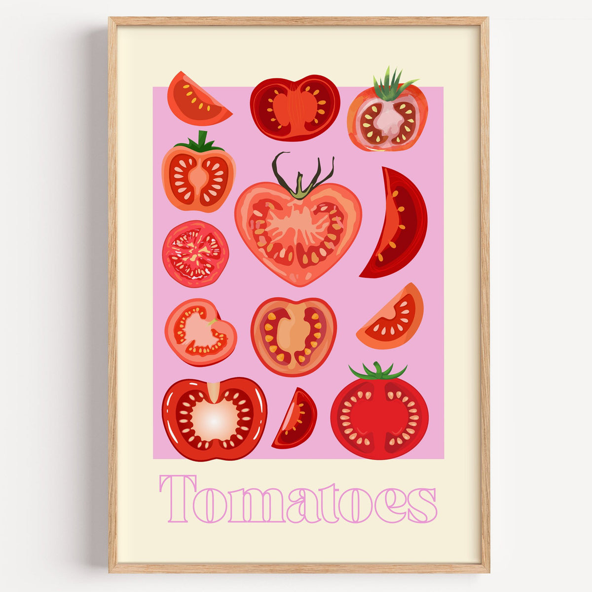Tomatoes cross sections pink panel print in a light oak frame on a plain white wall