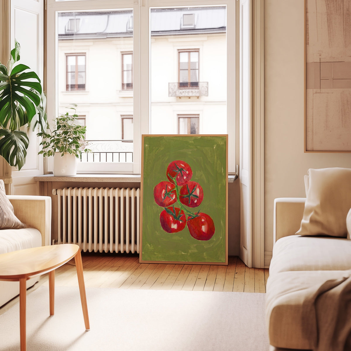 Red tomato kitchen print in an oak frame leaning below tall French windows
