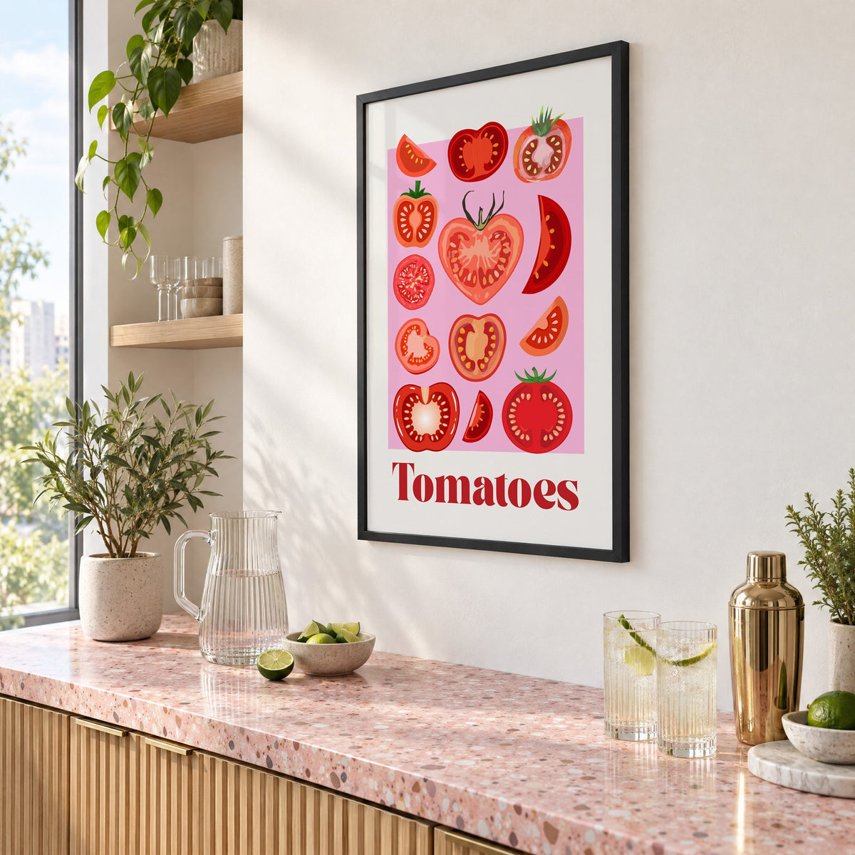 Tomatoes bold serif pink panel tomato chart print in a black frame above a pink terrazzo cocktail counter with limes, seen at an angle