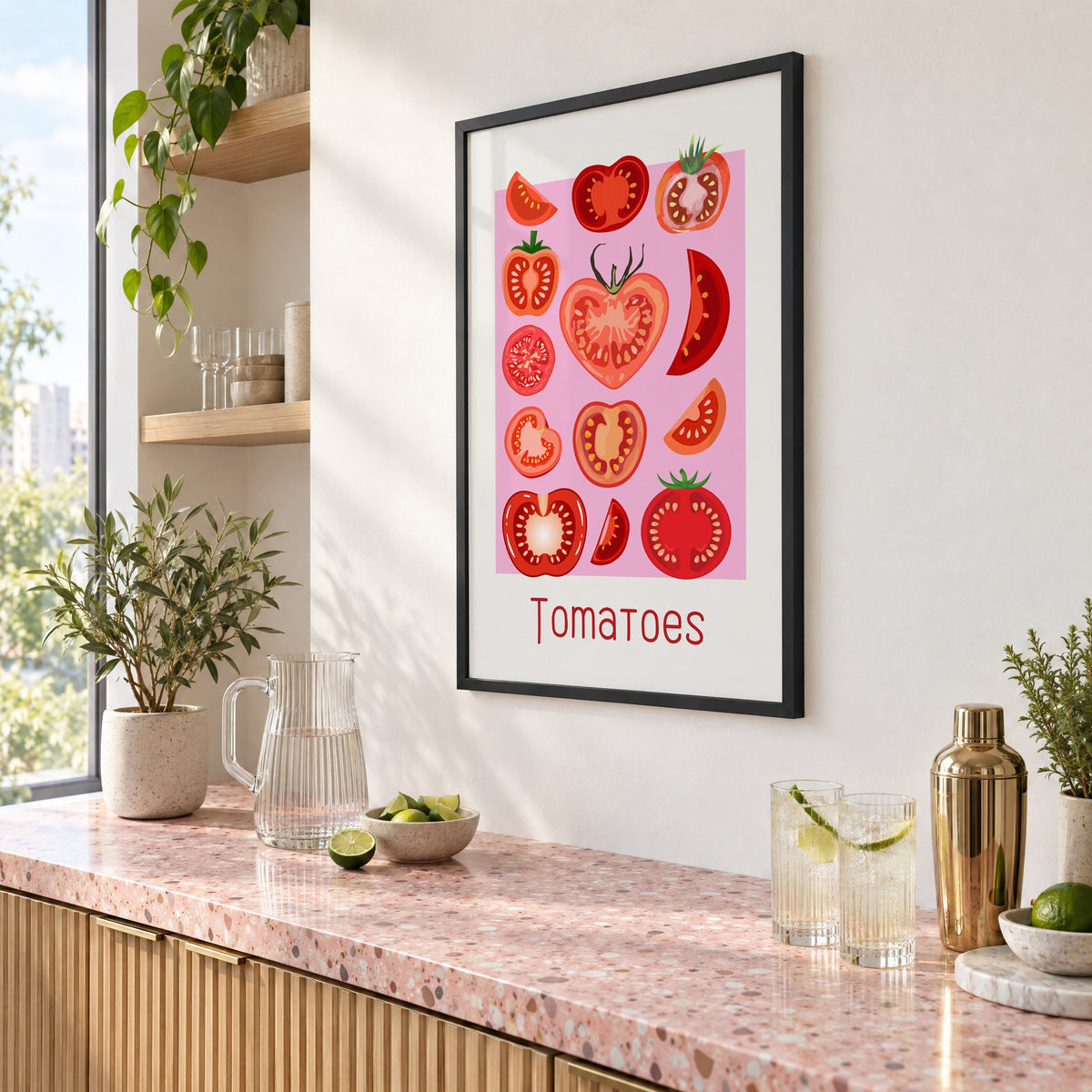 Tomatoes thin lettering pink panel tomato chart print in a black frame above a pink terrazzo cocktail counter with limes, seen at an angle