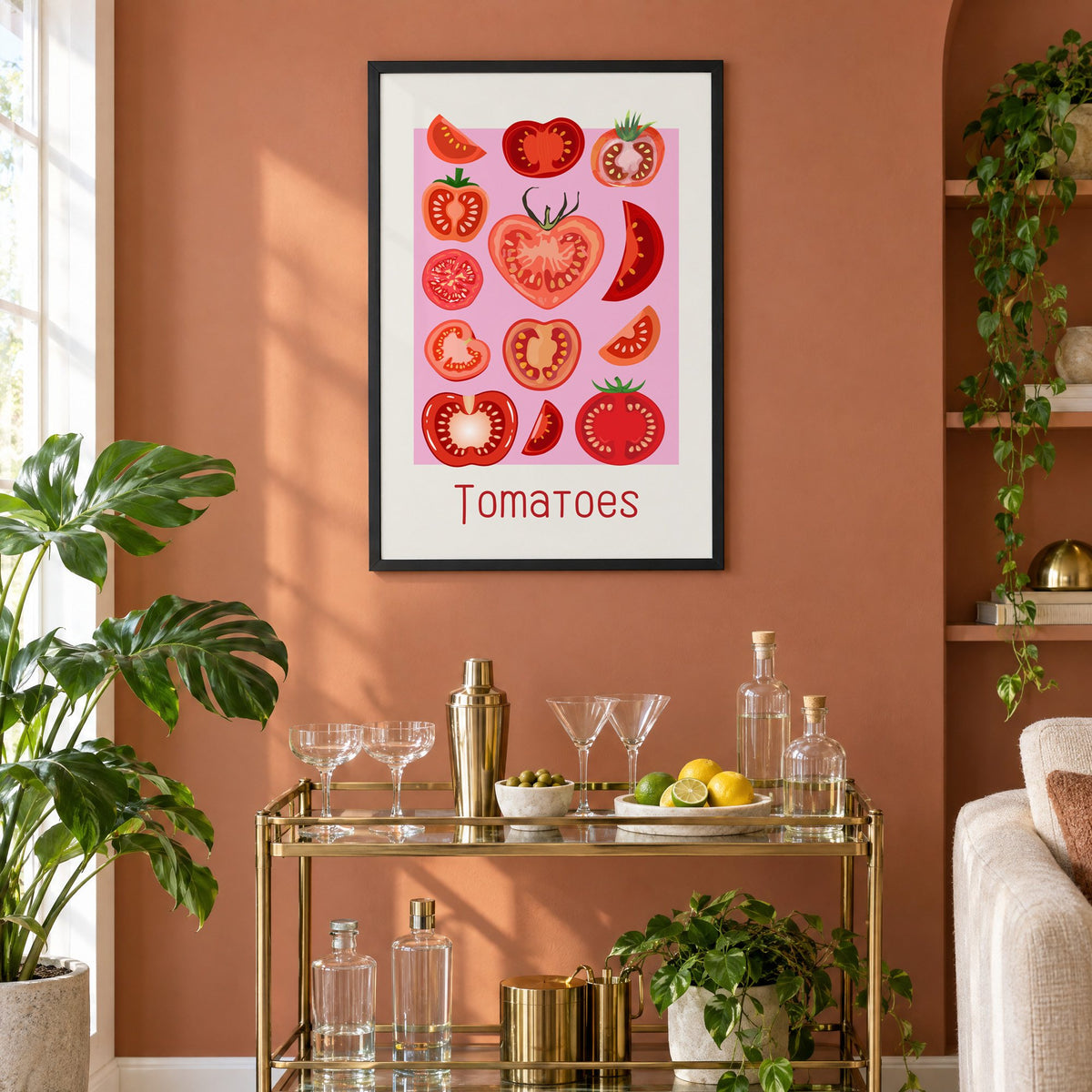 Tomatoes thin lettering pink panel tomato chart print in a black frame on a terracotta wall above a brass bar cart with coupes and citrus