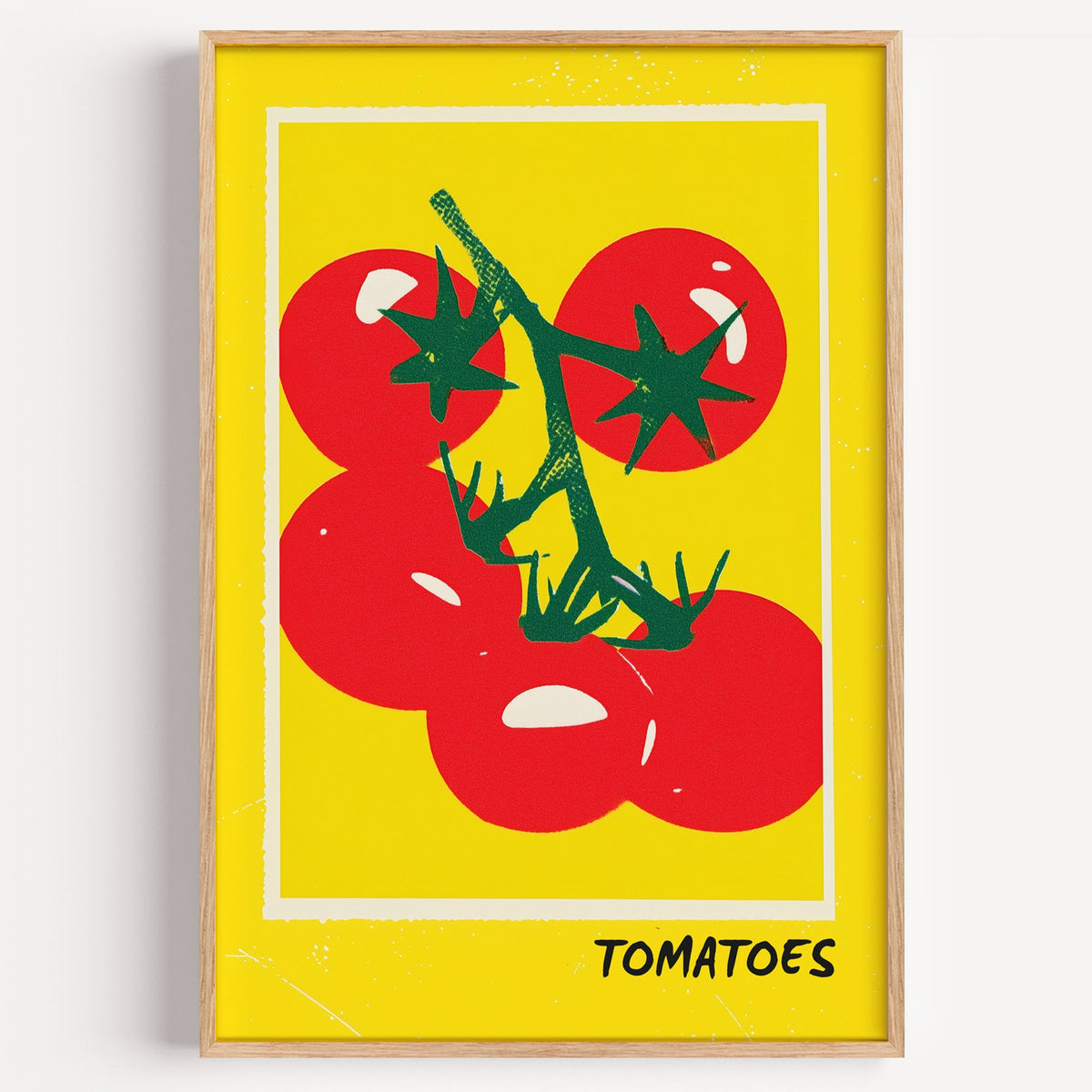 Tomatoes yellow bold print in a light oak frame on a plain white wall