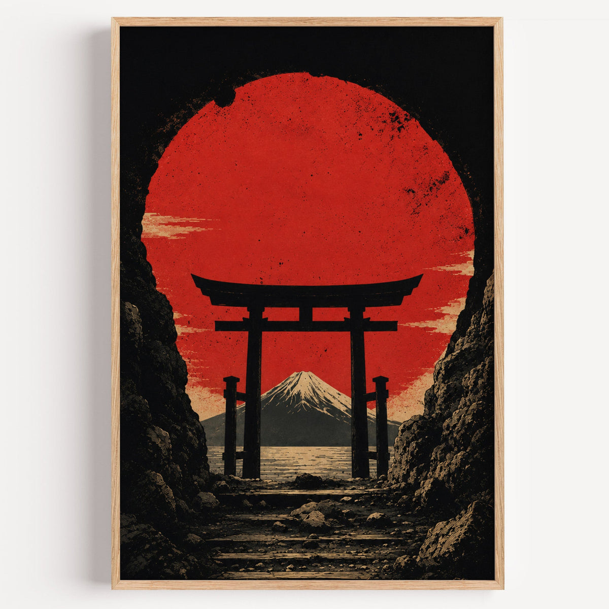 torii gate framing Mount Fuji and red sun print in a light oak frame on a plain white wall
