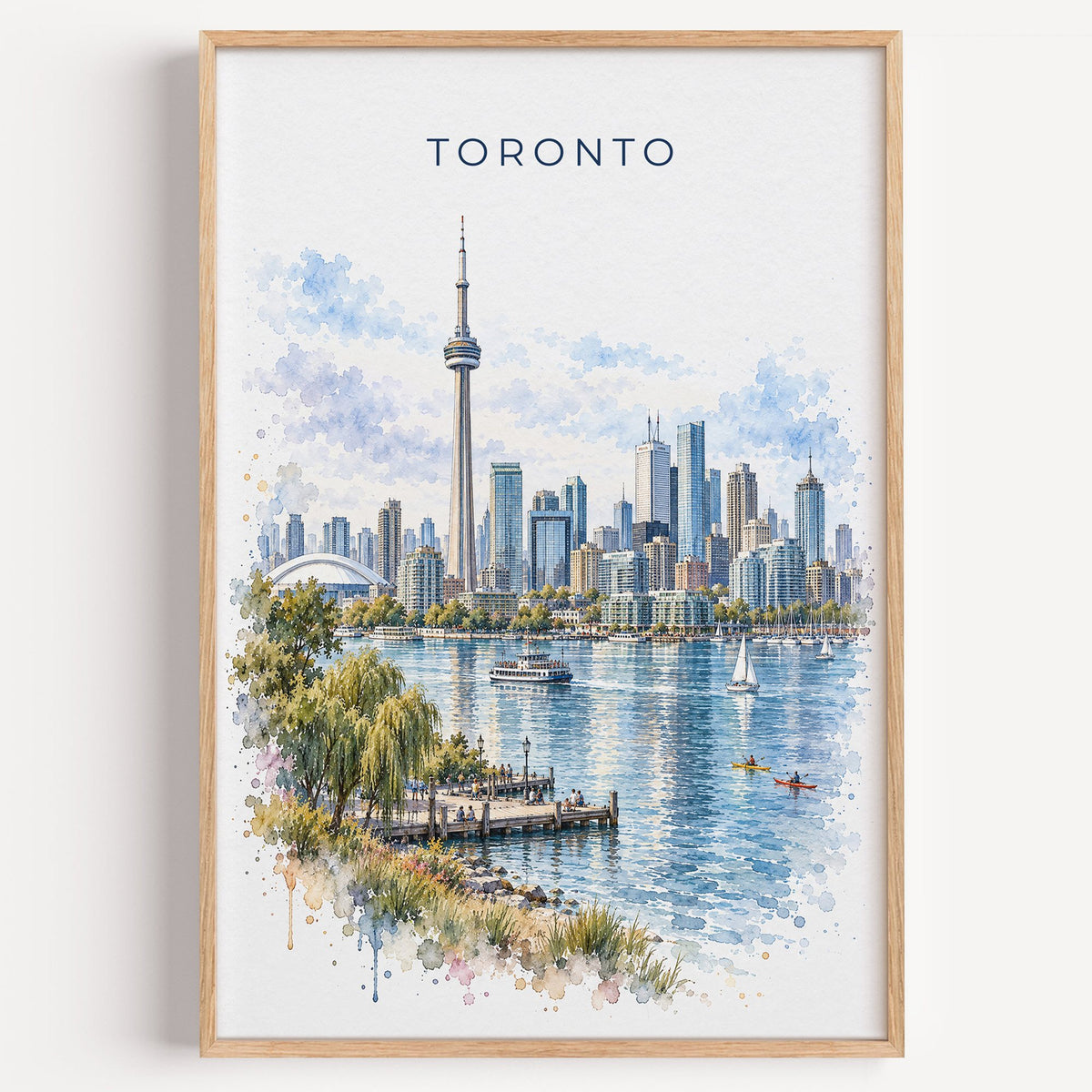 Toronto watercolor print in a light oak frame on a plain white wall