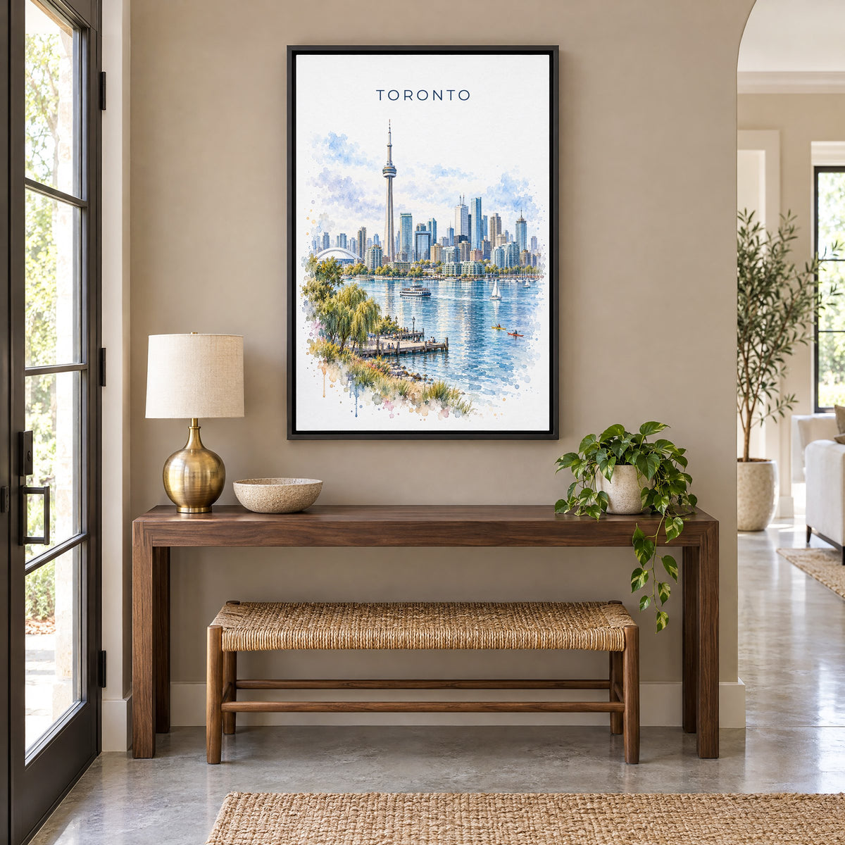 Toronto watercolor print as a black floater canvas above a walnut console and woven bench in an entryway