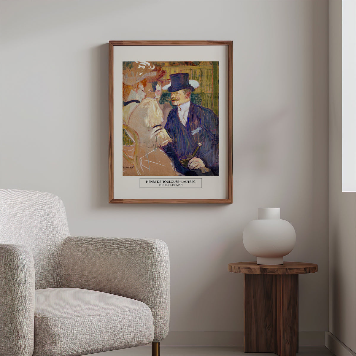 Moulin Rouge painting print in a slim walnut frame above a bouclé armchair