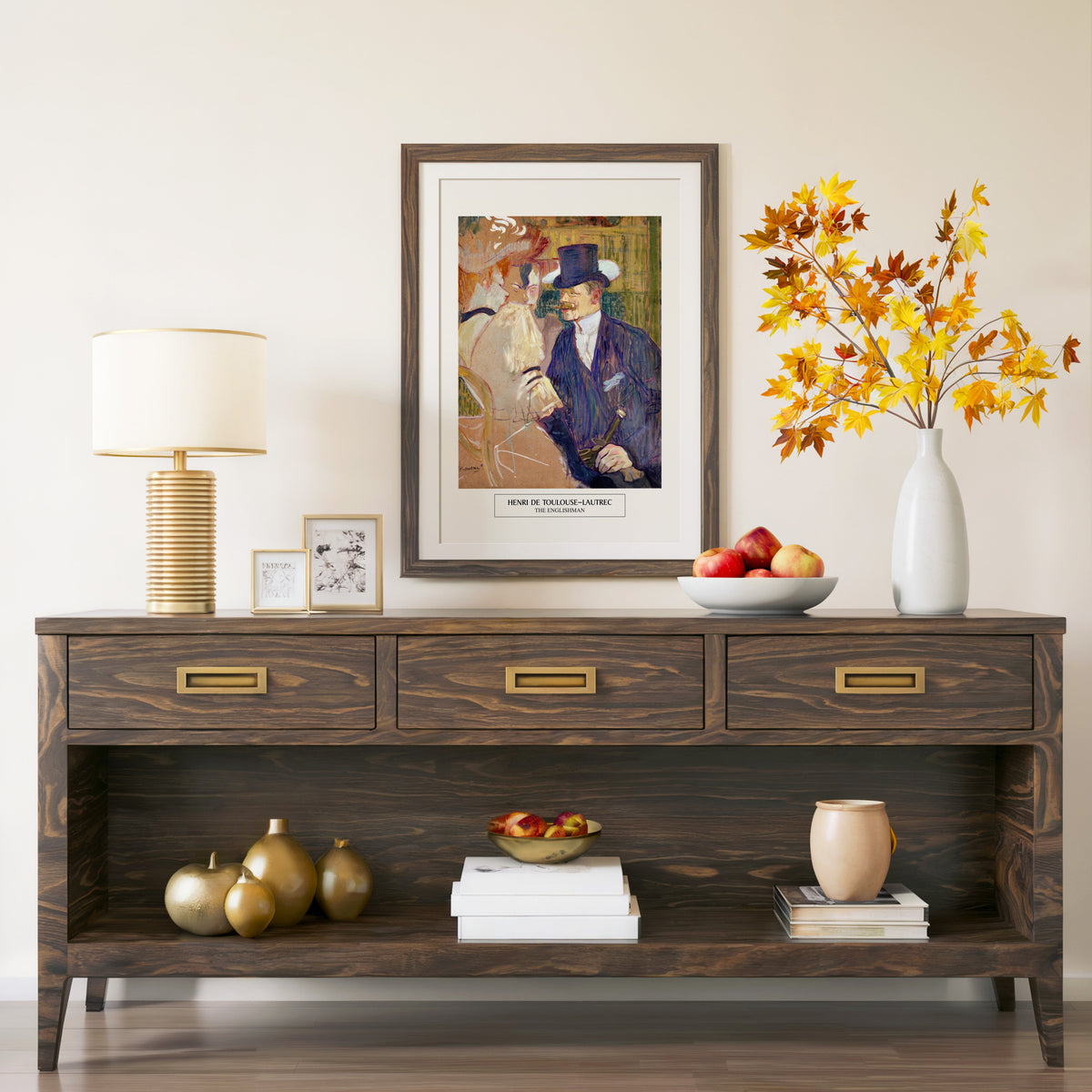 The Englishman print in a walnut frame above a console with autumn branches