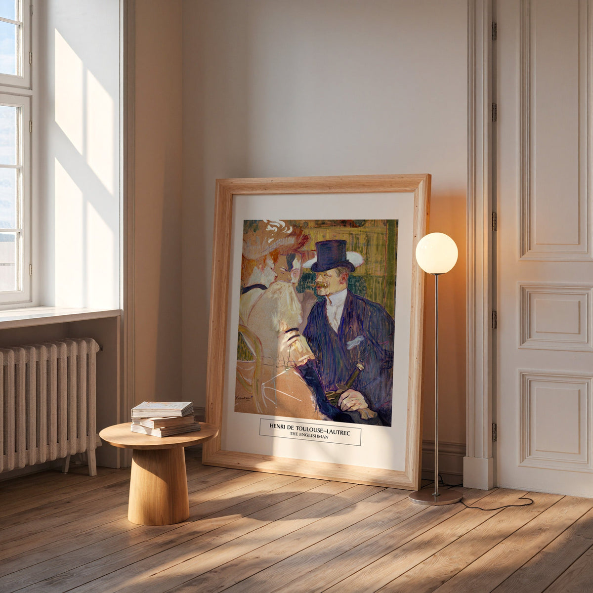 Lautrec Englishman print in a wide pine frame leaning by a sunlit window