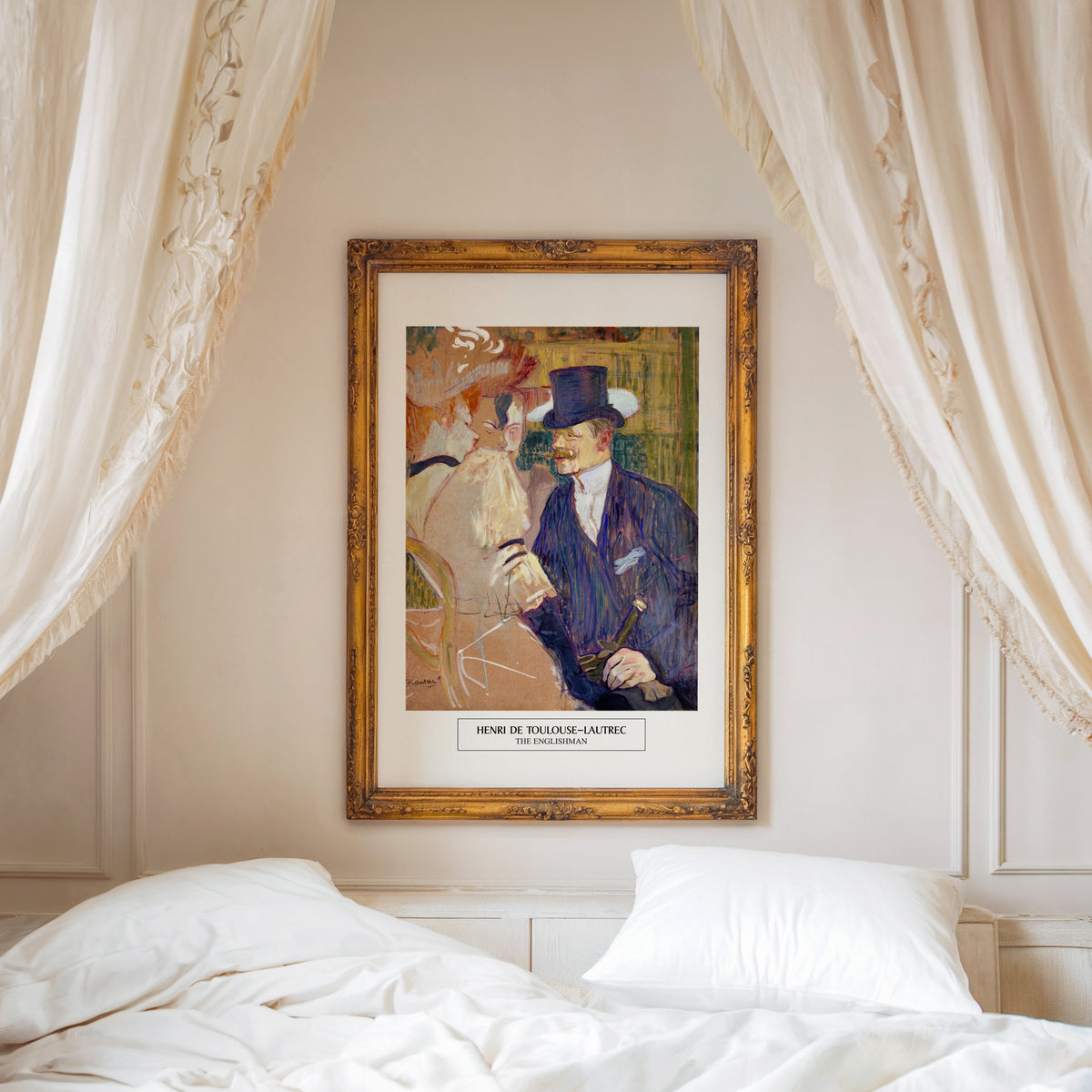 Moulin Rouge print shown in an ornate gold frame above a canopy bed