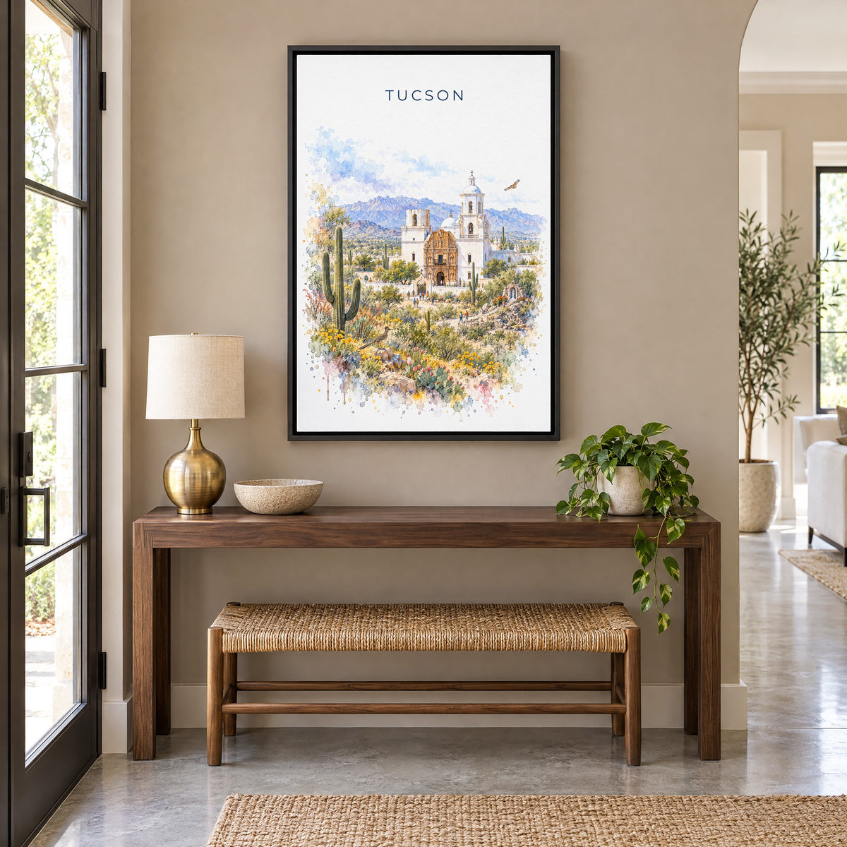 Tucson watercolor print as a black floater canvas above a walnut console and woven bench in an entryway