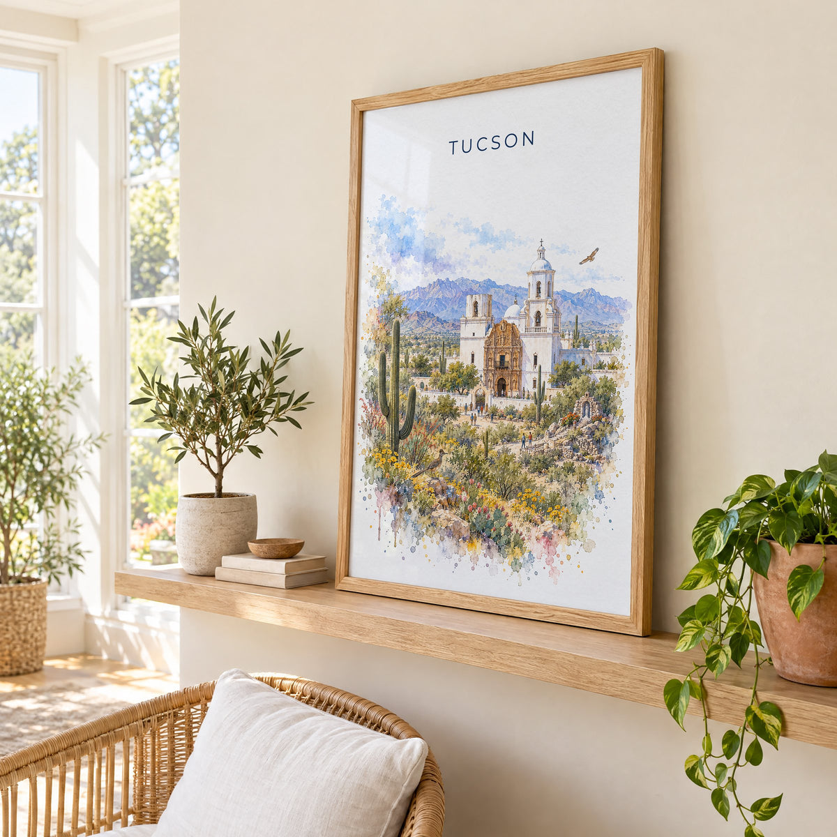 Tucson watercolor print in an oak frame on a picture ledge in a sunlit sunroom