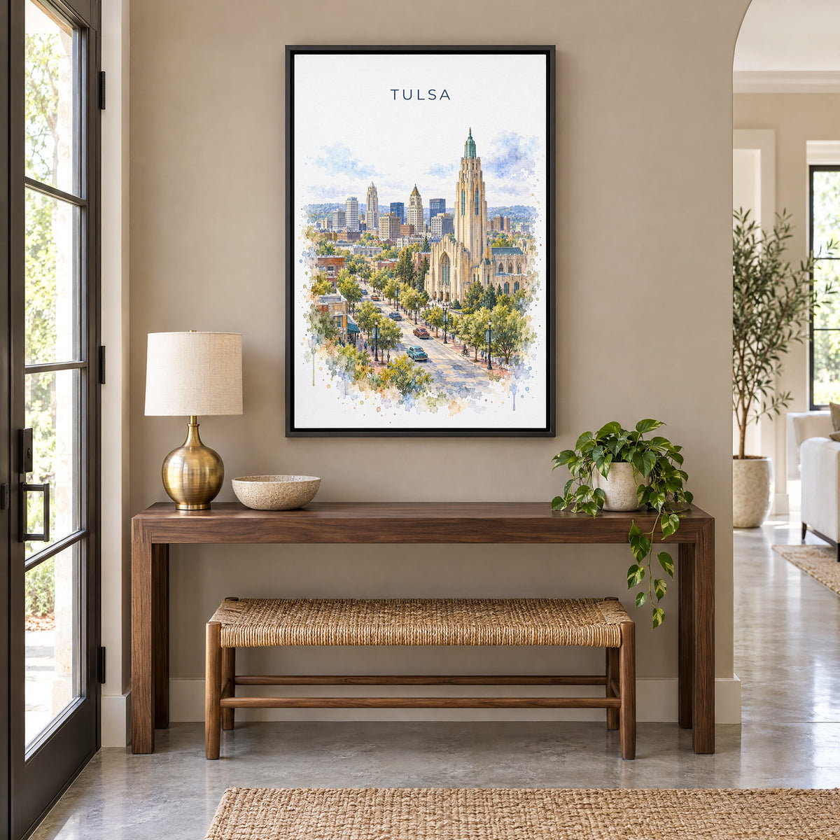 Tulsa watercolor print as a black floater canvas above a walnut console and woven bench in an entryway