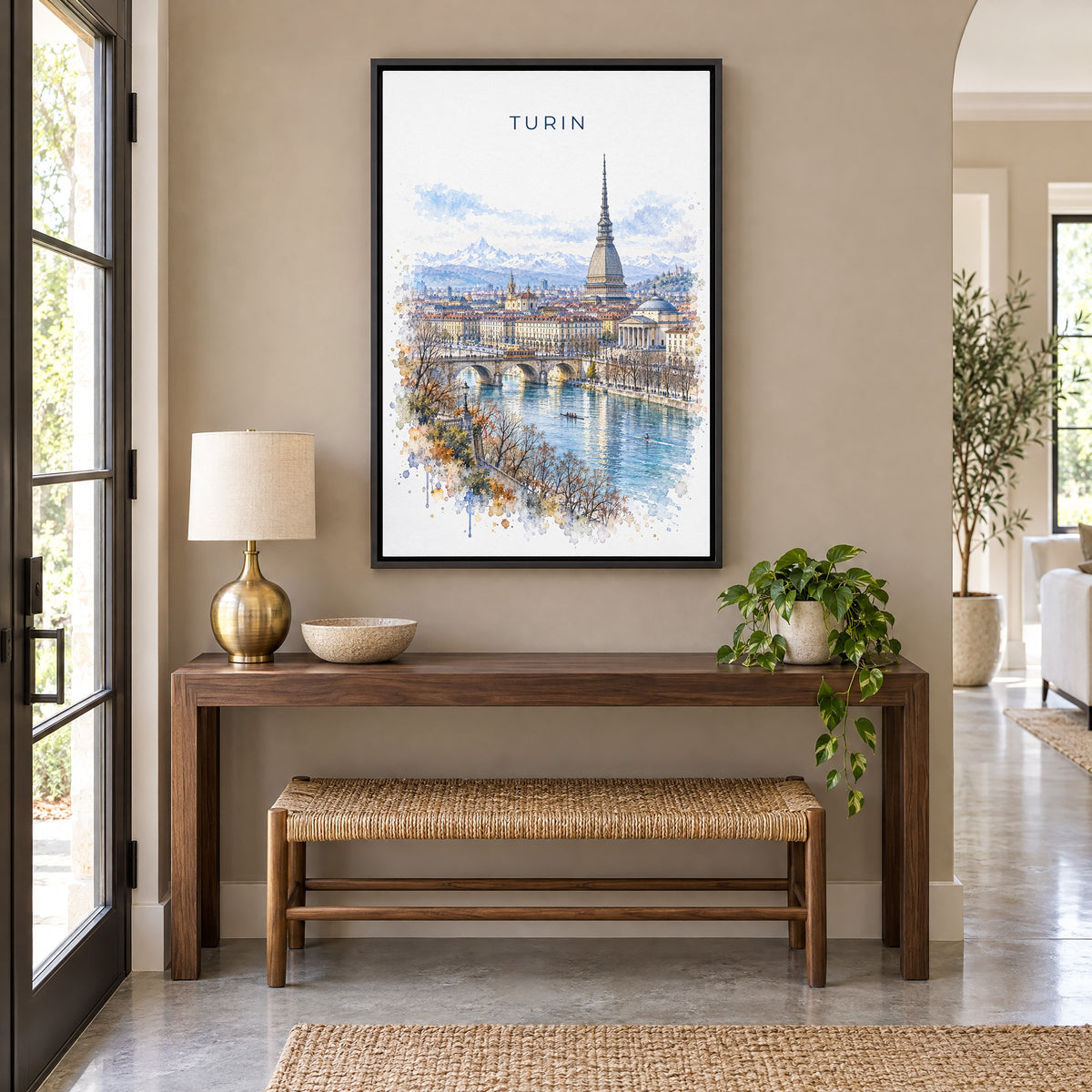 Turin watercolor print as a black floater canvas above a walnut console and woven bench in an entryway