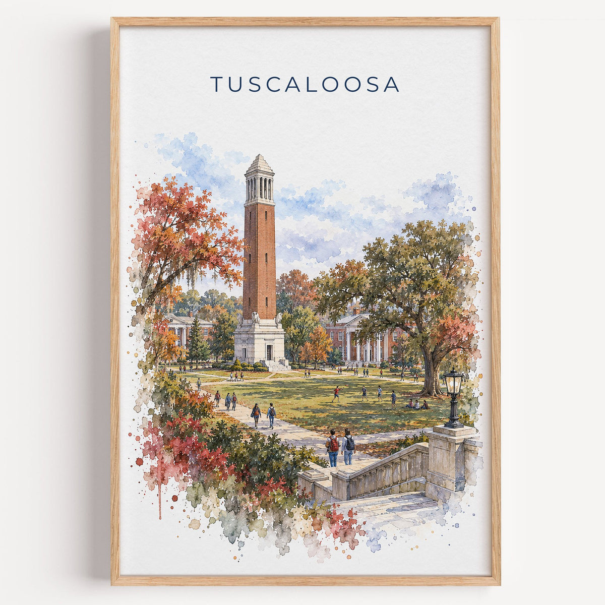 Tuscaloosa watercolor print in a light oak frame on a plain white wall