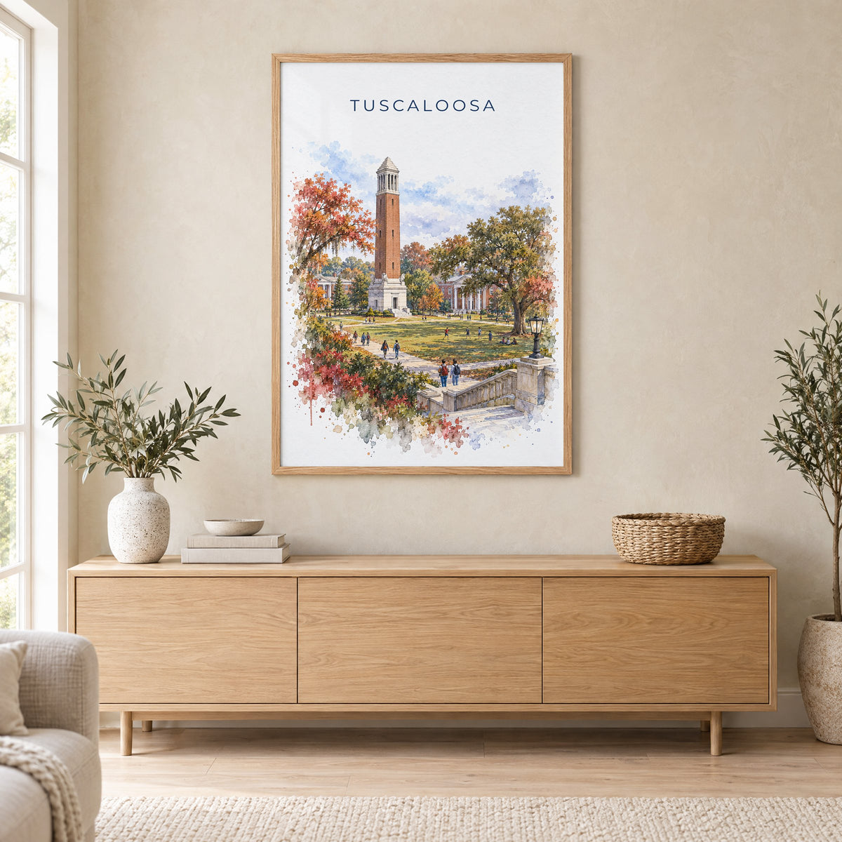 Tuscaloosa watercolor print in an oak frame above a light wood sideboard in a Scandinavian living room