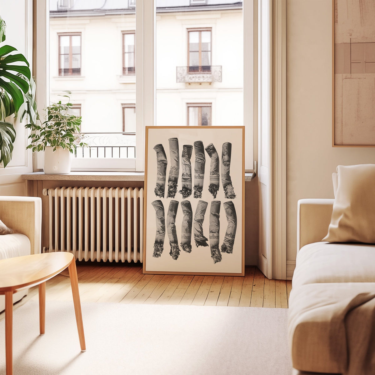Twelve crushed cigarette ends in two rows print in an oak frame leaning by a French window in a living room