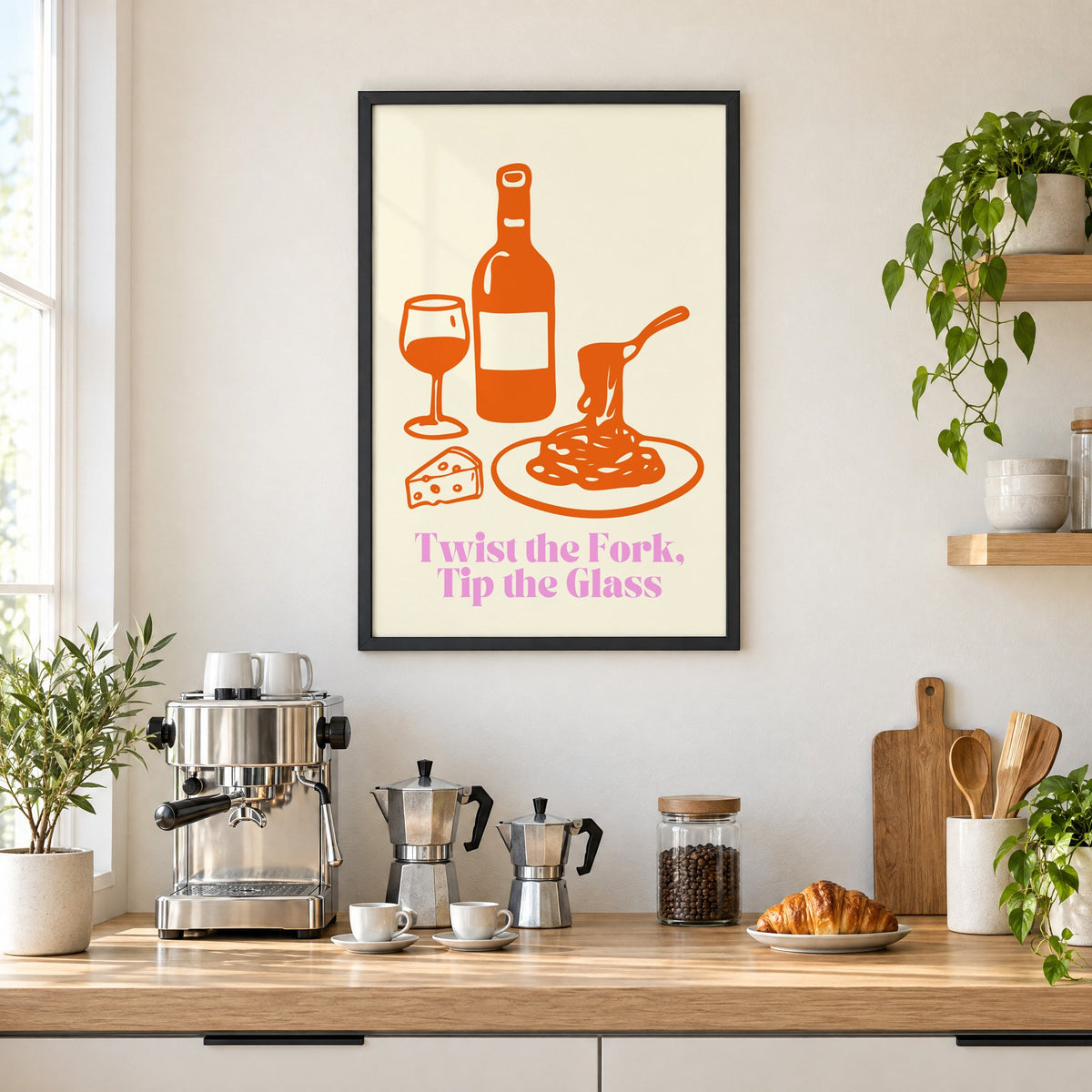Twist the Fork, Tip the Glass wine and pasta print in a black frame above a home espresso bar with moka pots and espresso cups